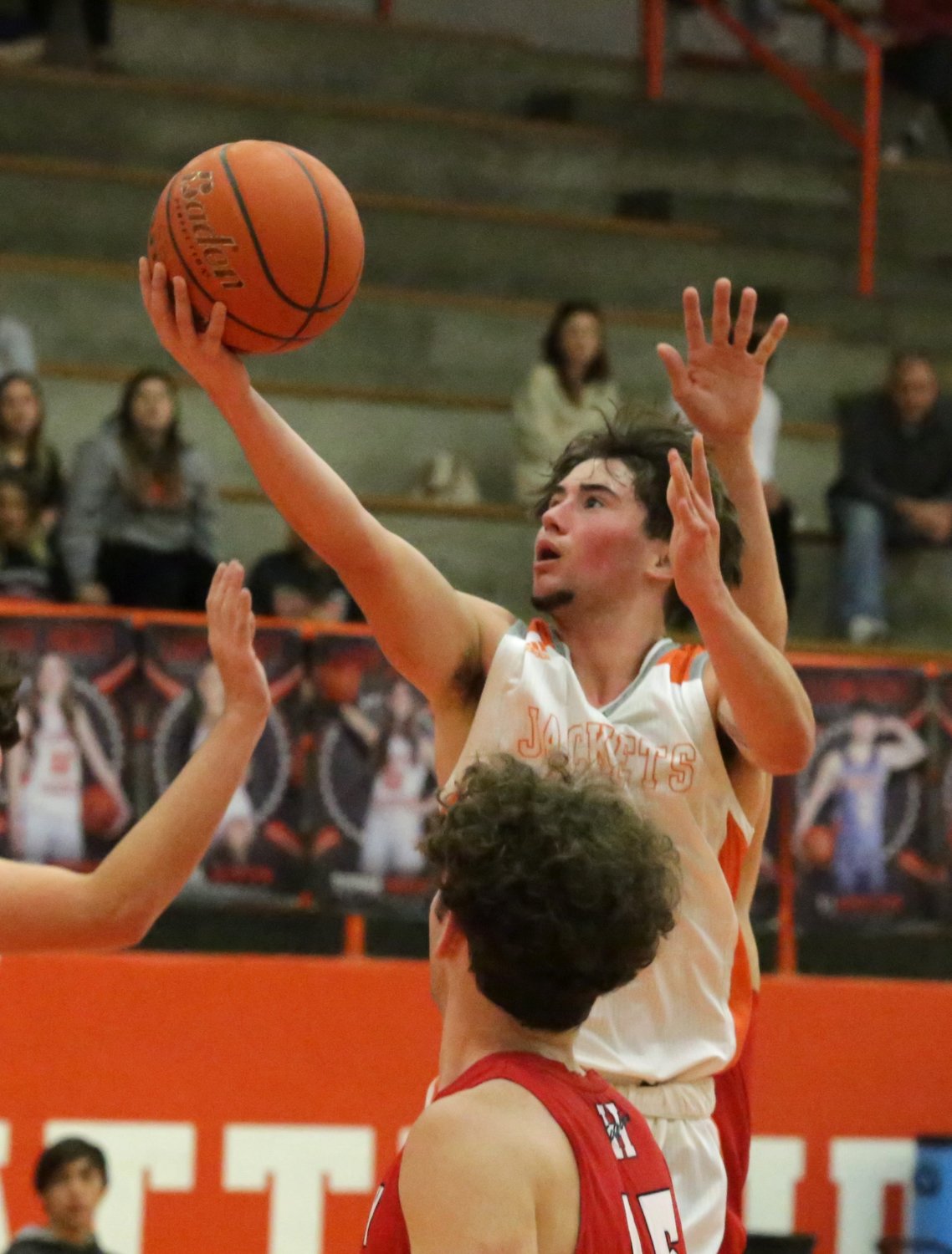 T.J. Moreland goes for a lay up in Friday’s final regular season  game for the Mineola Yellowjackets.